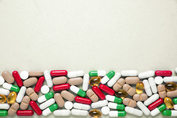 Pharmaceutical preparations, background. Colorful medications Pills, tablets and capsules are scattered. Medical concept