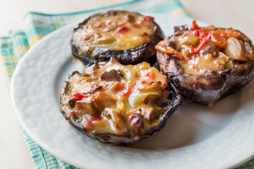 Baked Chestnut Mushrooms Stuffed with Melted Cheese and Vegetables.