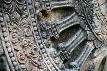 Close up stone carving of the wheel of the dharma. in archaeological site of Srithep ancient town...