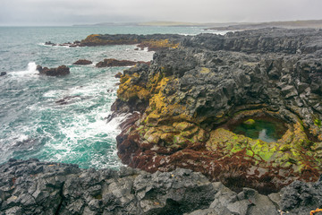 Brimketill naturally carved pool and lava beach in Reykjanes Penninsula, Iceland