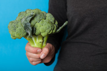 Diet agricultural broccoli in hand.