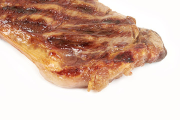 Grilled beef steak isolated over white background.