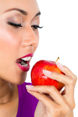 Close-up of a young woman eating apple