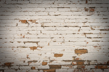 Background of old vintage dirty brick wall with peeling plaster, texture