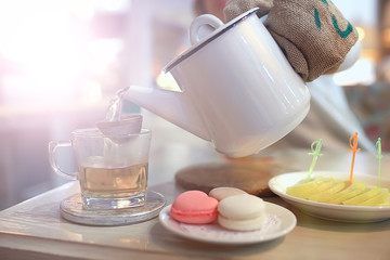 English tea in a cafe / cup and kettle with five o'clock tea