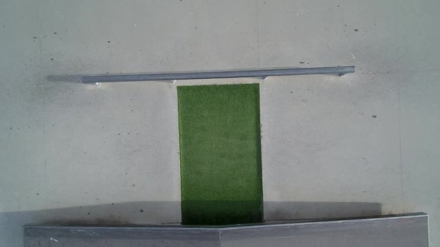 AERIAL, Top perspective shot of a skateboarder doing a backside lip-slide in 4K