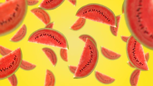 Watermelon slices falling down on yellow background. 4k video.