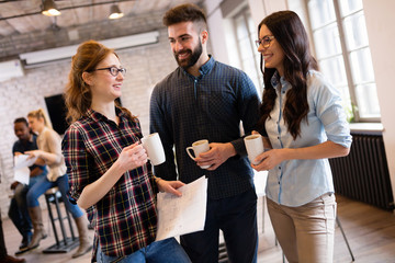Portrait of young architects discussing in office