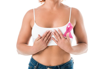 cropped shot of woman in white underwear with pink ribbon touching breast isolated on white