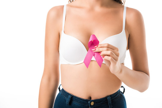 cropped shot of woman in bra holding pink ribbon, breast cancer awareness concept