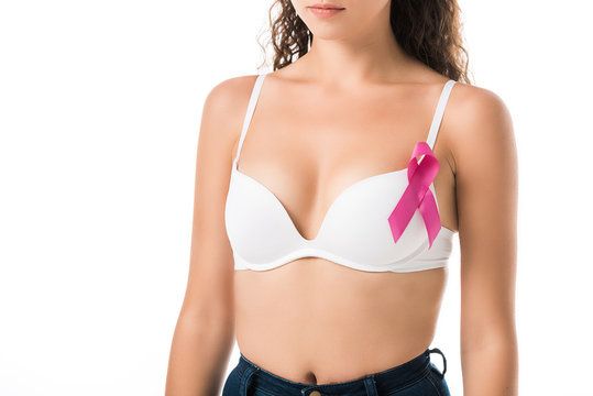 cropped shot of young woman in bra with pink ribbon, breast cancer awareness concept
