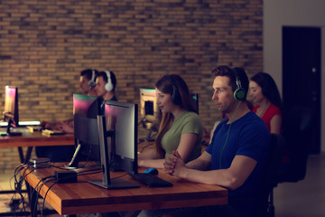 Young people playing video games at tournament
