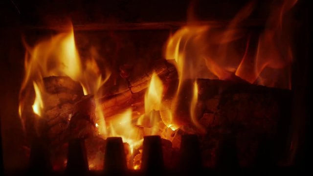 Close-up of fire burning in fireplace on cold, rainy winter night in South Africa