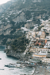 The coast of Positano, Amalfi in Italy. Panorama of the evening city and the streets with shops and...
