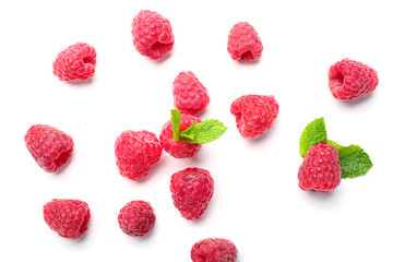 Delicious ripe raspberries with mint on white background
