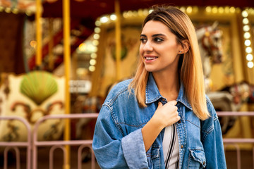 portrait of a girl in American style on a swing laughs and rejoices