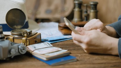 Female hand is surfing the net, this lifestyle new generation of people on the travel. Concept of travel. - Powered by Adobe