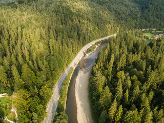 Aerial view to road with moutains captured from above © bartoshd