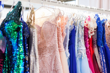 Rack with chic evening dresses.