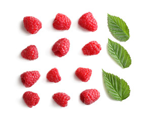 Delicious ripe raspberries with leaves on white background, top view