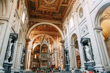 Salvatore Church in Rome, view from outside and inside. Frescoes and statues, architectural elements. A historic landmark, tourist destination. Ancient painting
