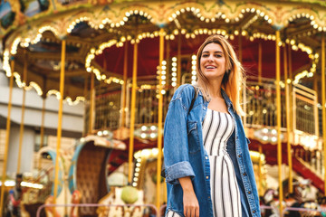 Obraz premium portrait of a girl in American style on a swing laughs and rejoices