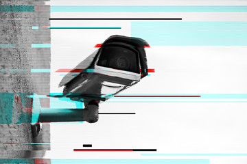Close up of security camera with digital glitch effect