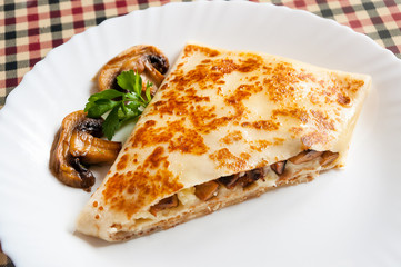 hot tasty pancake with potatoes and mushrooms