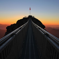 Stairway to heaven. Suspension bridge connecting two mountain peaks. Glacier 3000, Switzerland. - obrazy, fototapety, plakaty