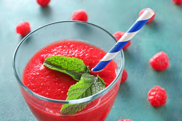 Glass of tasty raspberry smoothie, closeup