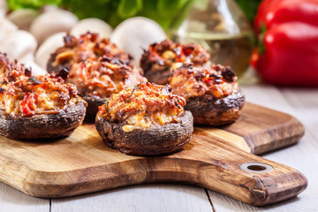 Baked champignon caps stuffed with minced meat