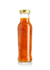Bottle with tasty sauce on white background