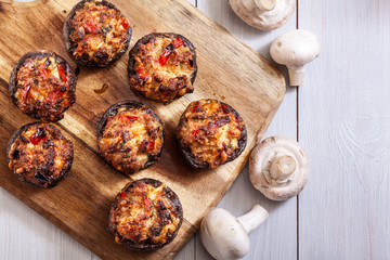 Baked champignon caps stuffed with minced meat