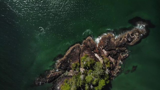 4K Drone footage of a beautiful empty beach with blue water, west coast landscapes of British Columbia Canada.