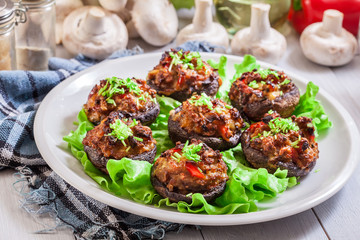 Baked champignon caps stuffed with minced meat