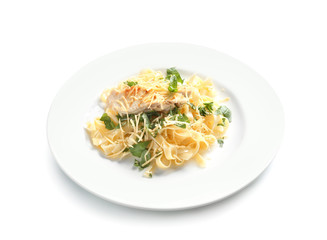 Plate of delicious pasta with chicken fillet and cheese on white background