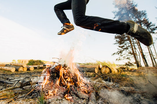 Man Is Jumping Over A Fire