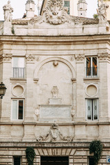 Obraz premium The architecture of Rome and the Italian style in stucco. Sights of the old town, tourist places. Street art, world heritage. Miracle of light. Carved columns and capitals