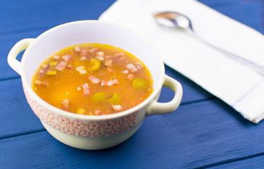 Soup of saltwort. Soup from different types of sausages, olives, potatoes, tomato paste.