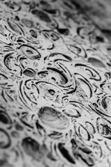 White decorative plaster close up. Detailed texture of wall in macro in grayscale. Designer background in monochrome.