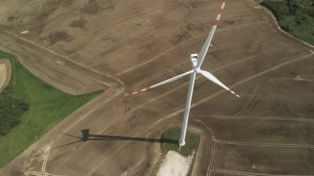 Beautiful aerial footage of wind turbines situated on farmland in Poland, 2018.