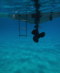 underwater back view of a little boat