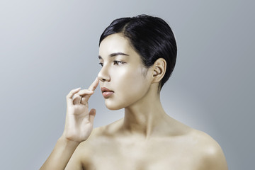 Closeup portrait of a young woman with beauty face and clean face skin