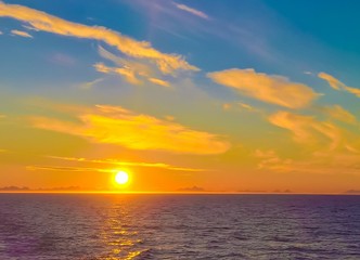 Obraz premium Sunset and sunrise over the sea and Lofoten archipelago from the Moskenes - Bodo ferry, Norway