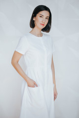 Smiling confident beautician posing in clinic of esthetic medicine.Smiling confident beautician posing in clinic of esthetic medicine. Aesthetics. Beauty. Medicine. Plastic surgeon.