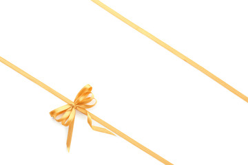 Golden ribbons with bow on white background