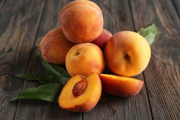 Naklejka na ściany i meble Fresh peaches on wooden table