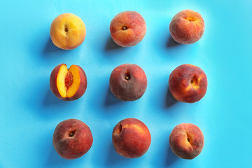 Fresh peaches on color background