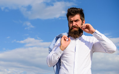 Fancy groom. Fashionable outfit stylish appearance. Hipster with beard and mustache looks attractive fashionable white shirt. Man bearded hipster white formal clothes looks sharp sky background