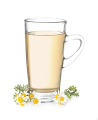 Glass cup of delicious camomile tea on white background